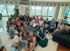 A joyful gathering of friends for food, games, and conversation.