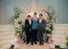 Mason, Synes, and Rockwell dressed up together at junior prom with a beautiful floral and candle display.