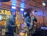 Brad and Matt perform together on stage at a lively gig.
