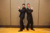 Matt and his friend strike a playful pose with matching gestures at the PCA ISM Gala