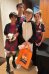 Four friends dressed for Halloween, three soccer teams and the penguin mascot