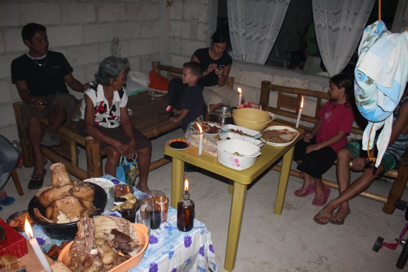 Christmas dinner at our cousin's house warming party.  Family was put into a separate room while neighbors ate in the living room area.  There was also a "brown out" during dinner so we ate by candle light.