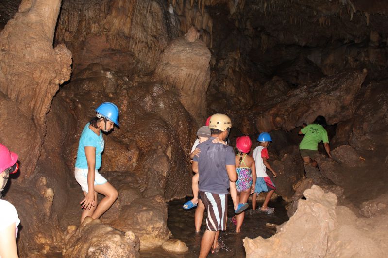 Cantabon Cave - Exploring where there really were not any rules (swimming and breaking off a stalactite for a souvenir) and our cousin carried Mason the whole time