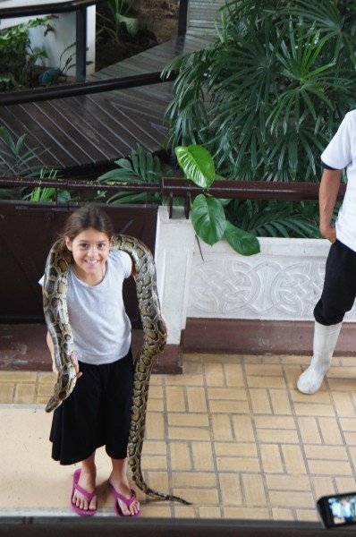 Kalani asked and answered questions at the snake farm and then willingly went up to have this python around her