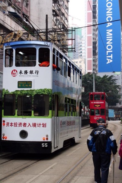 Old fashion double decker bus only costs about $.30 to ride, but it doesn't go very fast and makes many stops along the way and is crowded on a Saturday afternoon