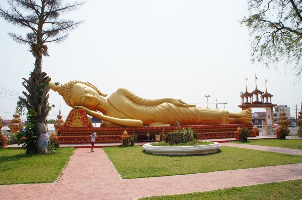 Laying Buddha at Pha That Luang reminded us of Thailand since they have one of these too.