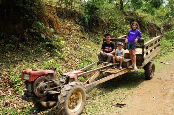 A Laoation tractor, also used as a means of transportation on the road for locals