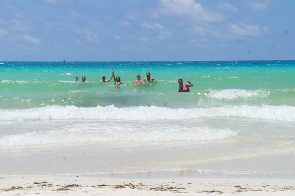 Farleys in the ocean and enjoying the white sand at the public beach.