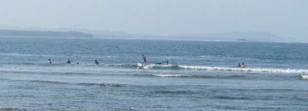 We made it to the famous "Cloud 9" surf spot. Matt and Tia got surfing lessons and we both stood up on our board. Here Tia is surfing a small wave.