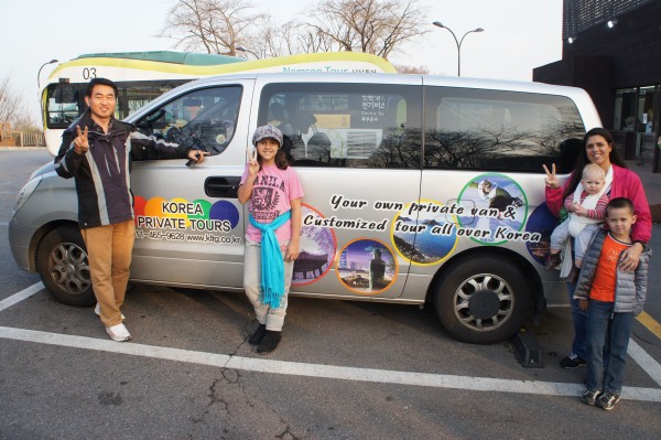 Us with our tour guide and his van.