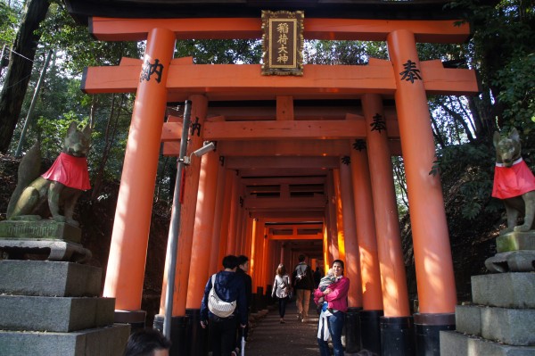 Fushimi Inari Shrine has hundreds of these orange pagodas in a line.