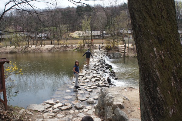 Kalani crossing one of the three different kinds of bridges at the Korean Folk Village.