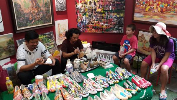 Matt bought our "Thailand painting" from these guys on a previous trip. Besides painting canvas art, they also paint shoes.