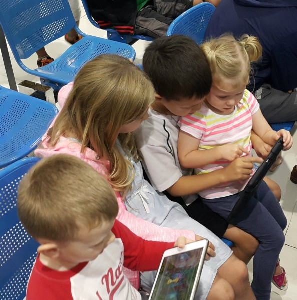 Our flight was delayed in Manila, so to pass the time the kids shared the iPads.