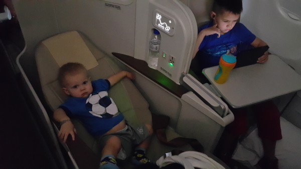 Philippine Air has a direct flight from Manila to Abu Dhabi that is nearly nine hours. To upgrade to business class is rather inexpensive for this flight, so that is what we did and even 16 month old Blake knows this is the preferred seating.
