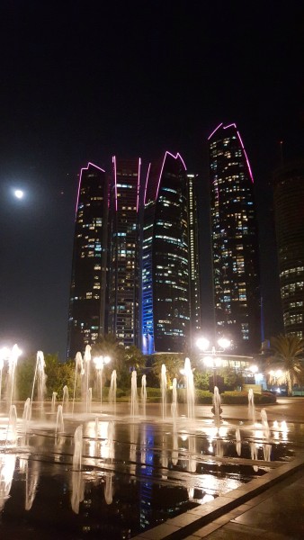 Night view of Etihad Towers that are across from Emirates Palace. The towers were used as a filming location for the 2015 film Furious 7. In the film, Dominic Toretto (Vin Diesel) and Brian O'Conner (Paul Walker) steal a Lykan HyperSport and drive it through three of the towers