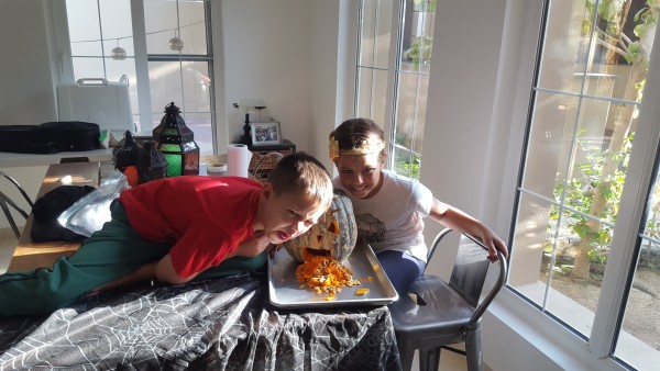 Mason got to help carve a pumpkin since it was Halloween. Poor boy is 6 years old and that was his first time to "carve" a pumpkin.