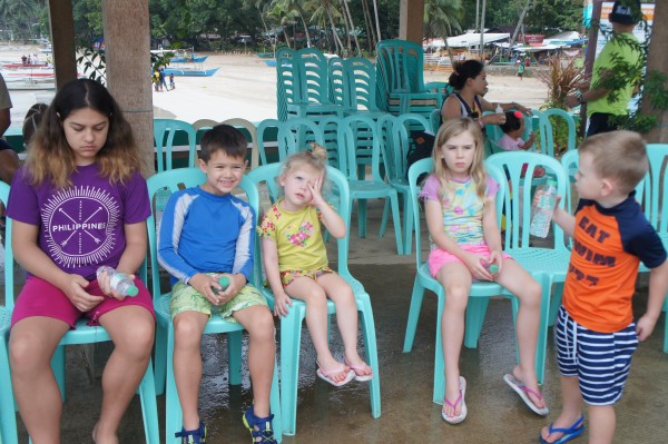 The kids waiting for the paper work to be completed before boarding the boat for the Underground River tour.