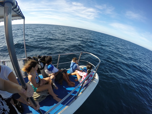 Christmas Day we got on a boat and headed towards Apo Island. Our kids wanted to be in the front.