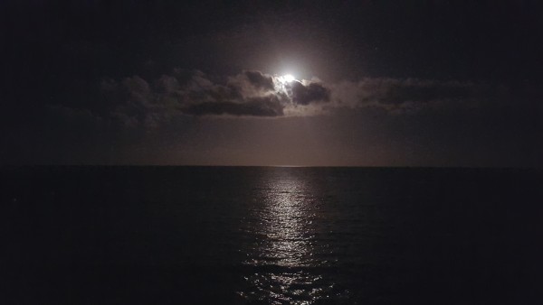 On the way back to the resort from our cousin's home we saw the moon shining over the ocean.